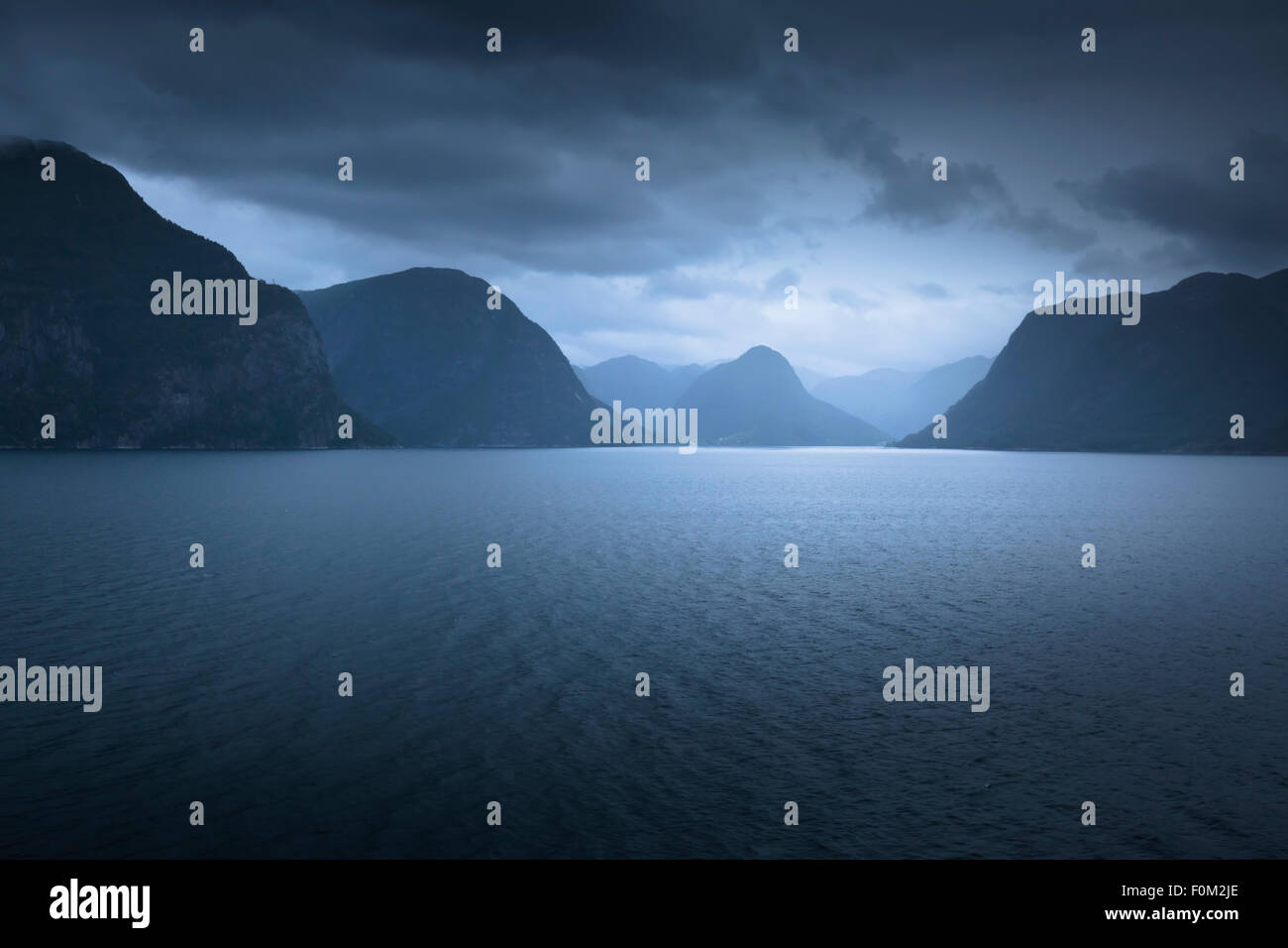 Foggy Evening Mood in the Sognefjord, Norway Stock Photo