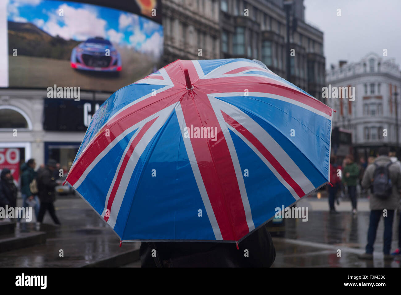 Union jack umbrella in Piccadilly Circus, London Stock Photo - Alamy