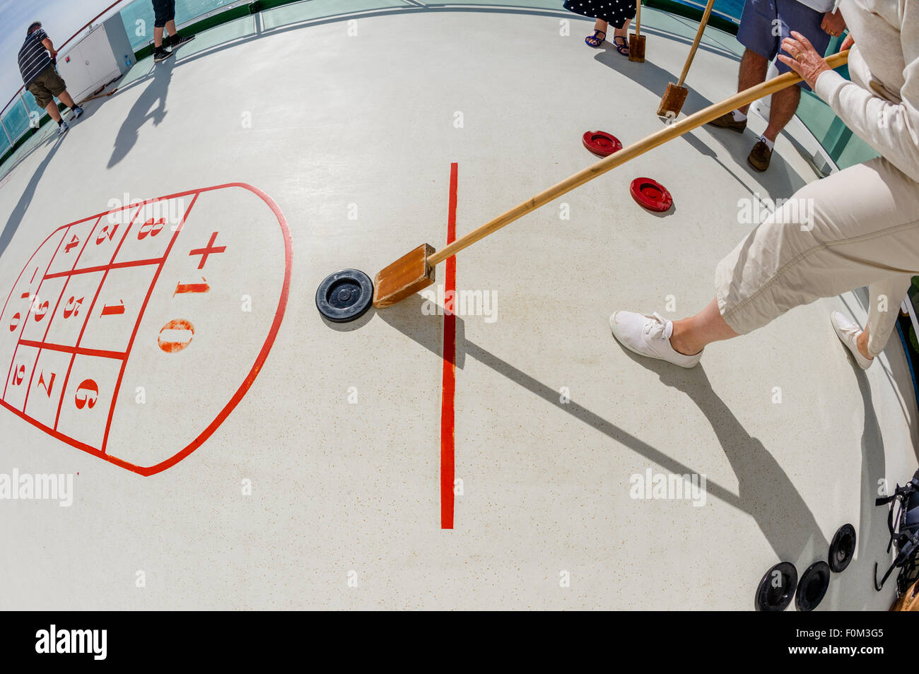 Passengers playing shuffleboard on board the P&O cruise ship Azura