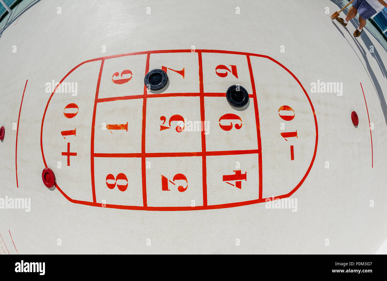 Passengers playing shuffleboard on board the P&O cruise ship Azura