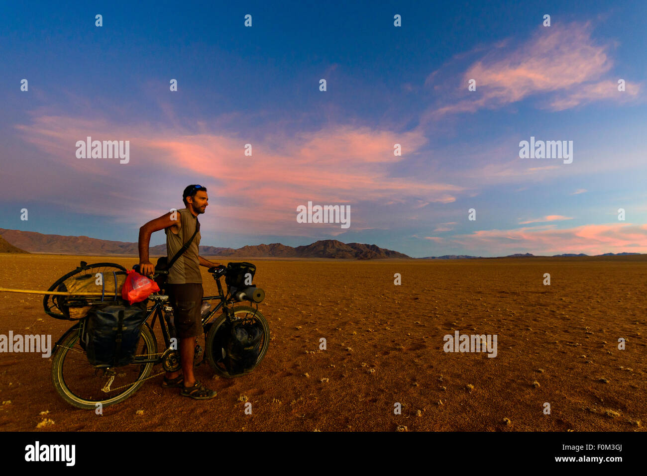 Cycling in the Namib desert, Namibia, Africa Stock Photo