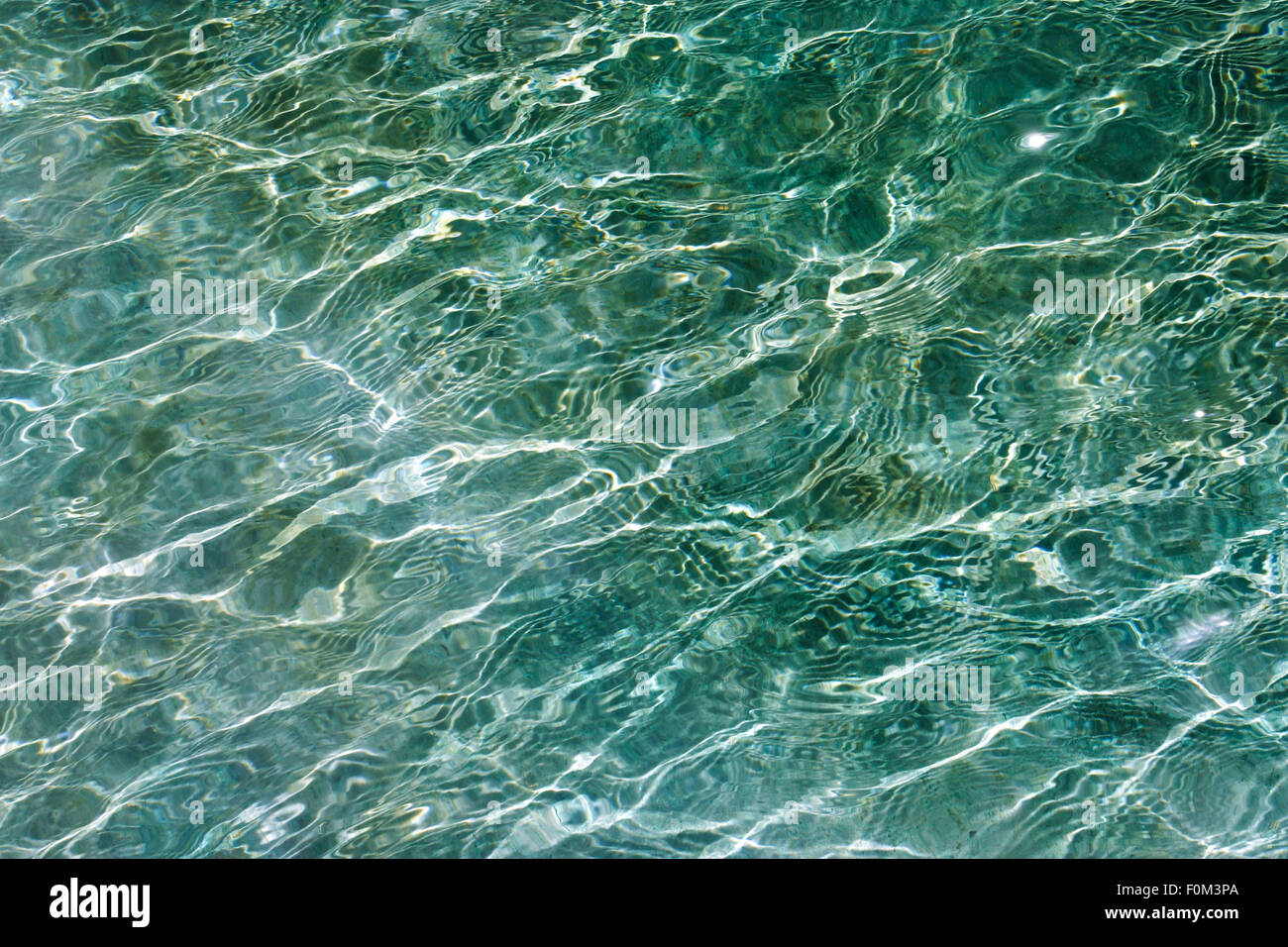 Blue rippling water, reflection into the swimming pool Stock Photo