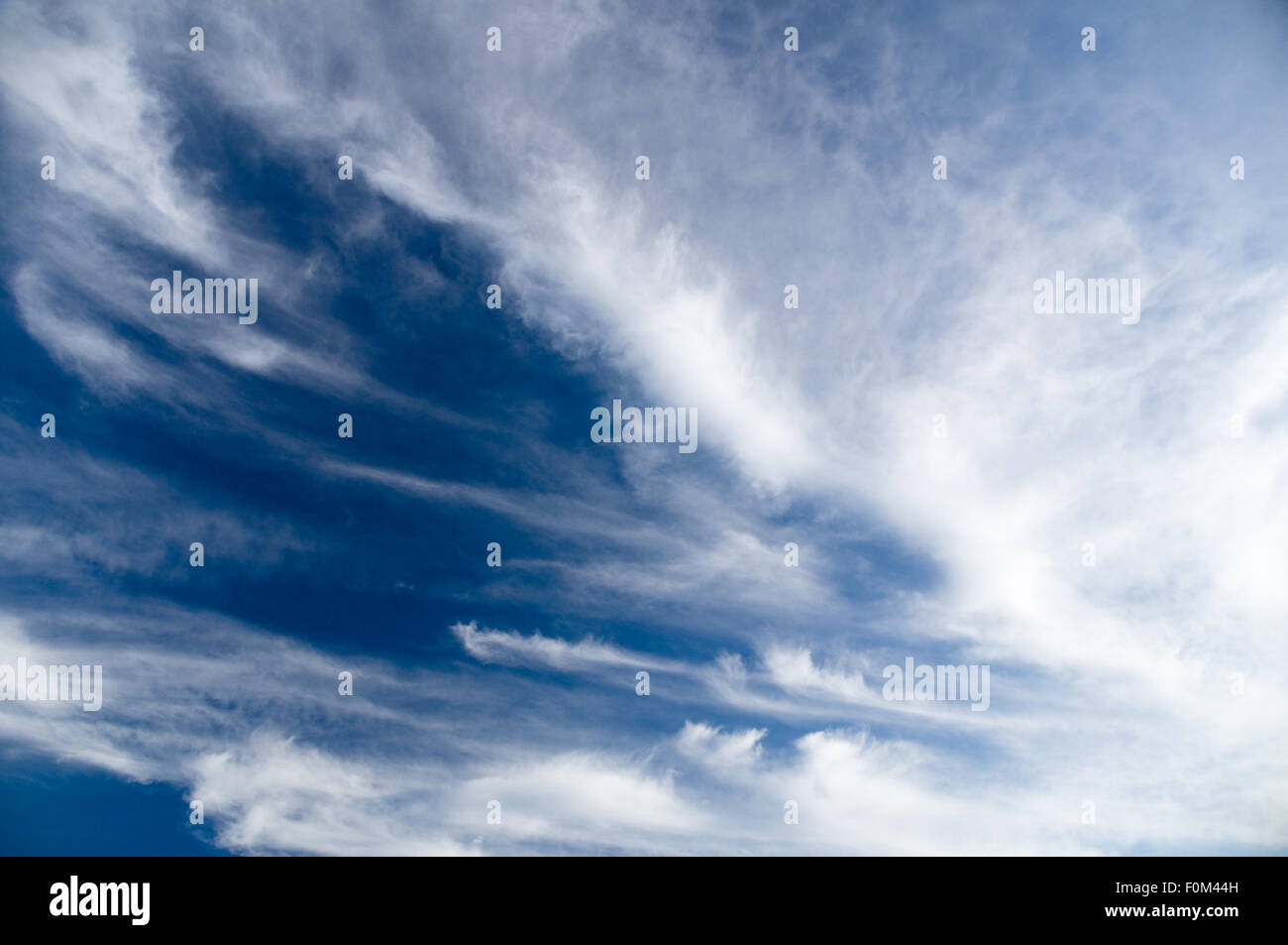 Wide view of blue sky with spreading cirrus clouds Stock Photo