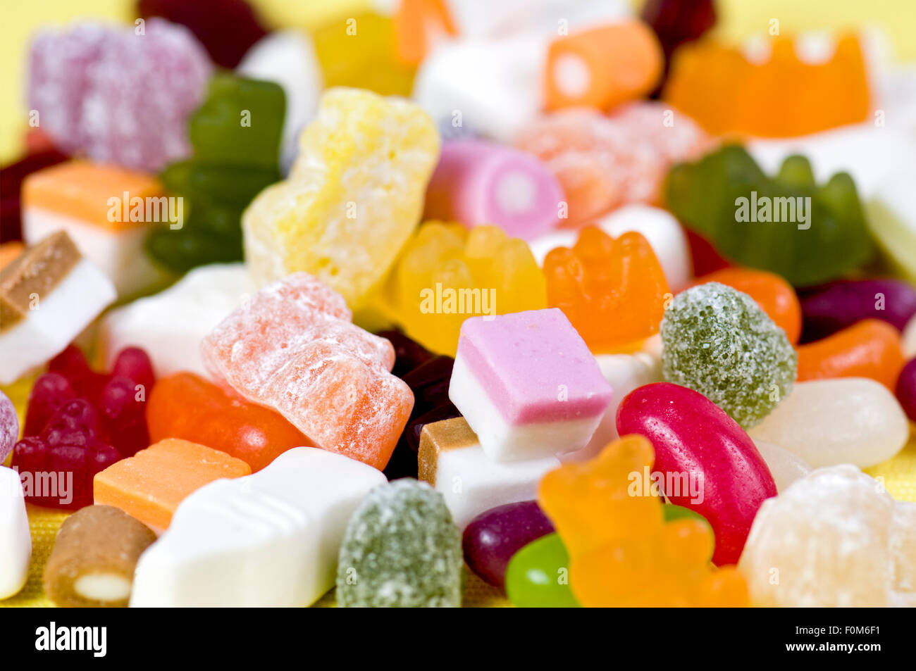 Mixture of childrens sweets including gummy bears, jelly beans, dolly