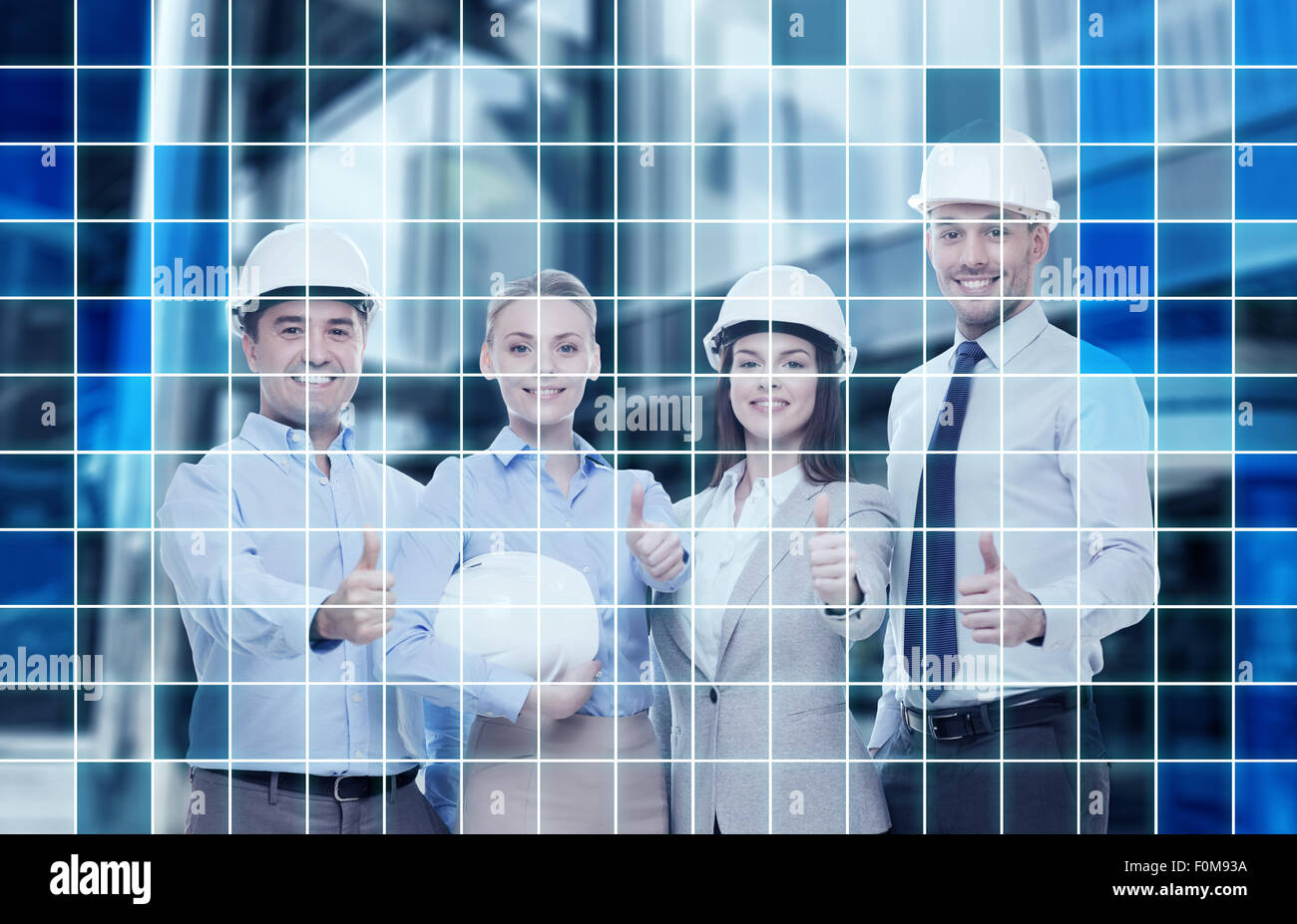 happy business team in office showing thumbs up Stock Photo - Alamy