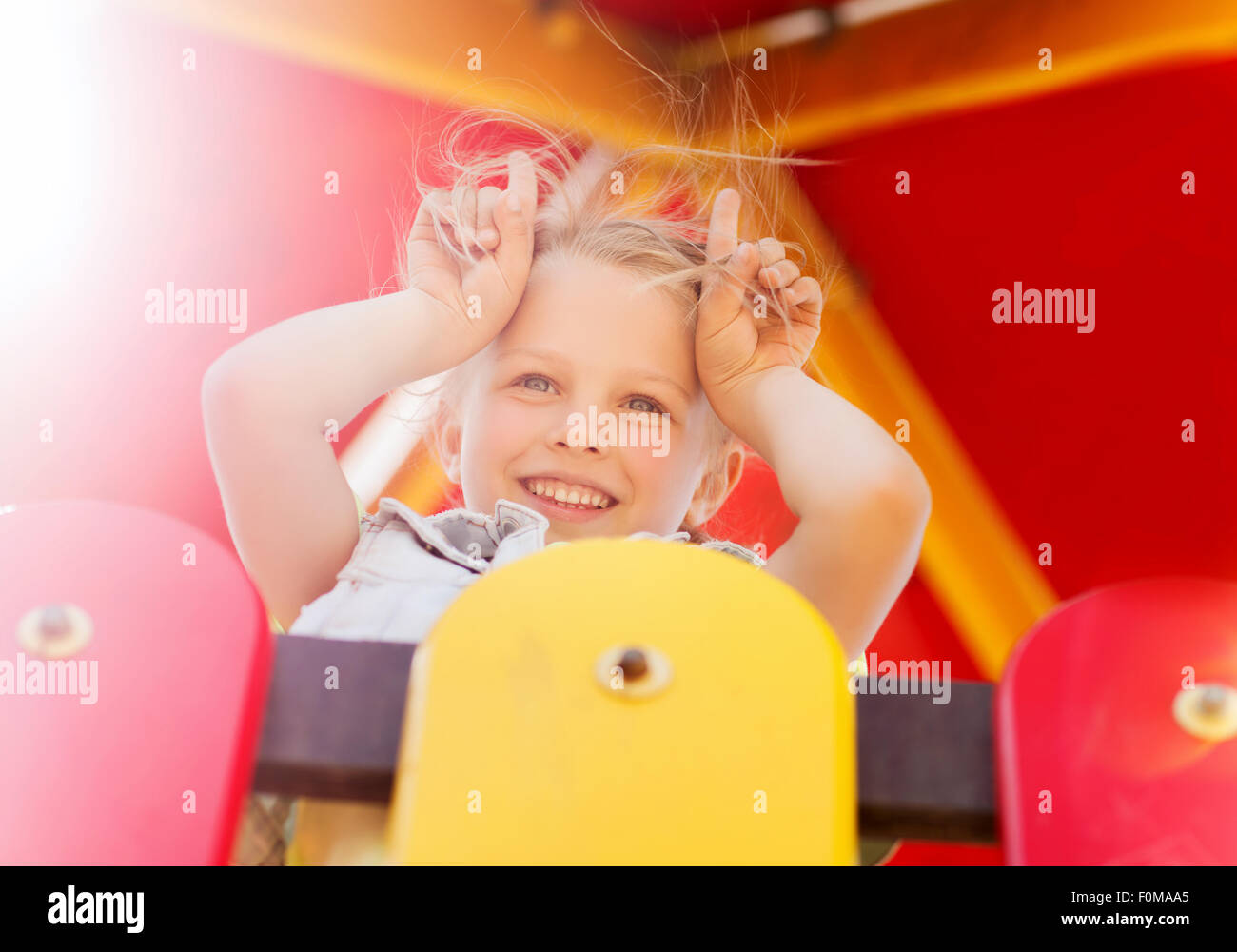 happy little girl on children playground Stock Photo - Alamy