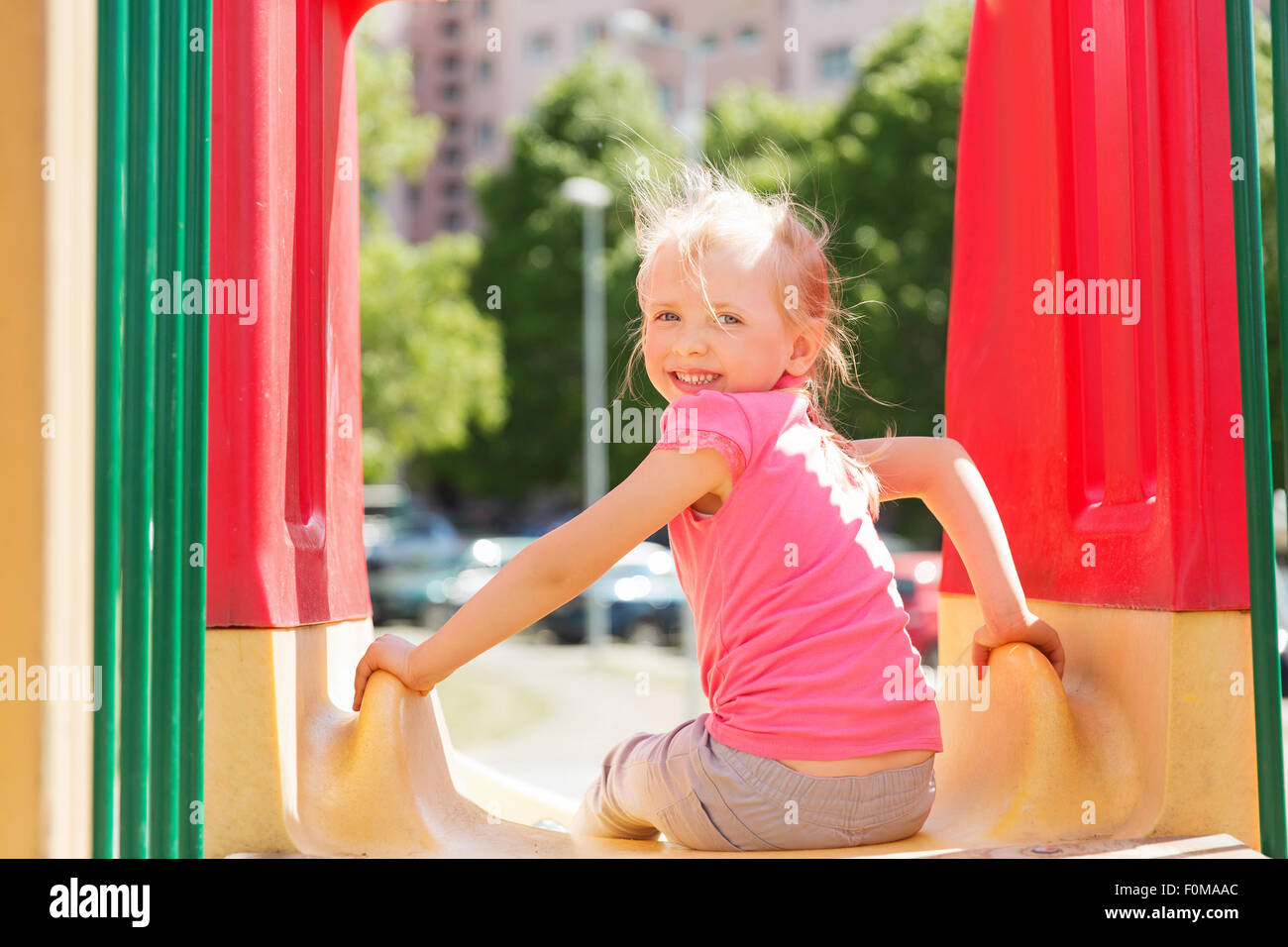 happy little girl on slide at children playground Stock Photo - Alamy