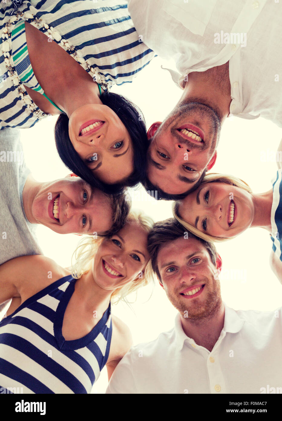 smiling friends in circle Stock Photo