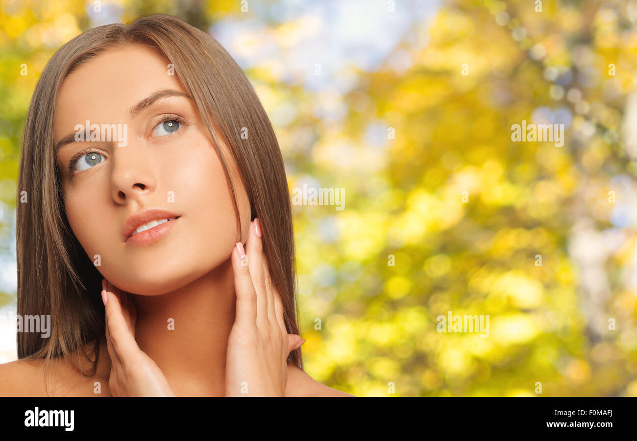 beautiful young woman touching her neck Stock Photo Alamy