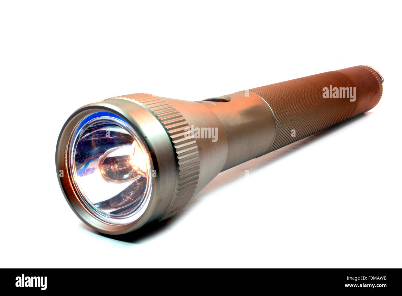 Metal flashlight isolated on a white background Stock Photo