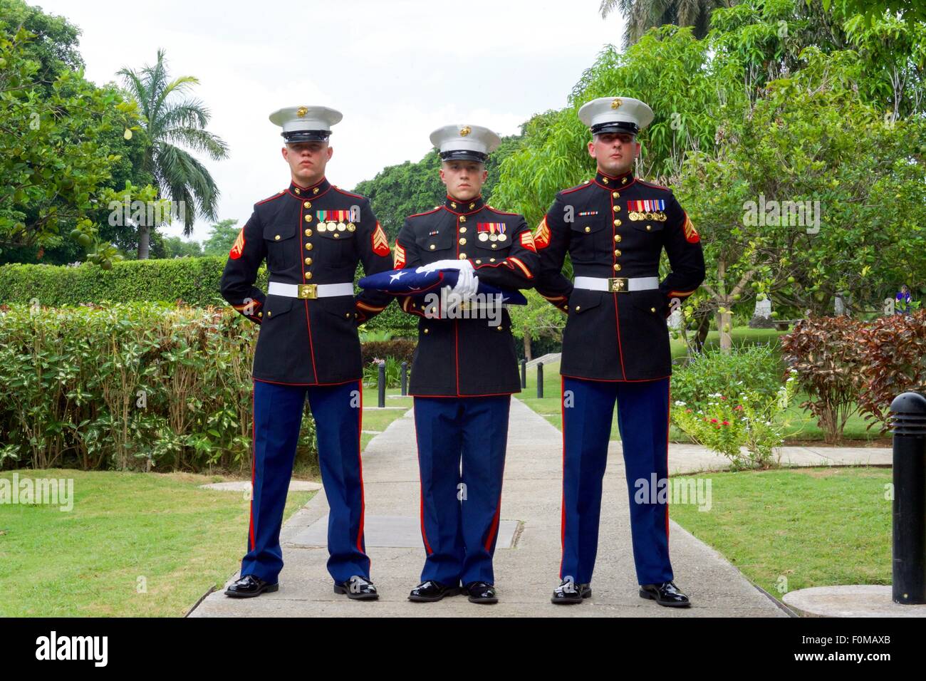 U.S. Marines stand ready to raise the flag during a ceremony at the Ambassador's residence August 14, 2015 in Havana, Cuba. The United States reopened the embassy in Cuba for the first time since 1961. Stock Photo