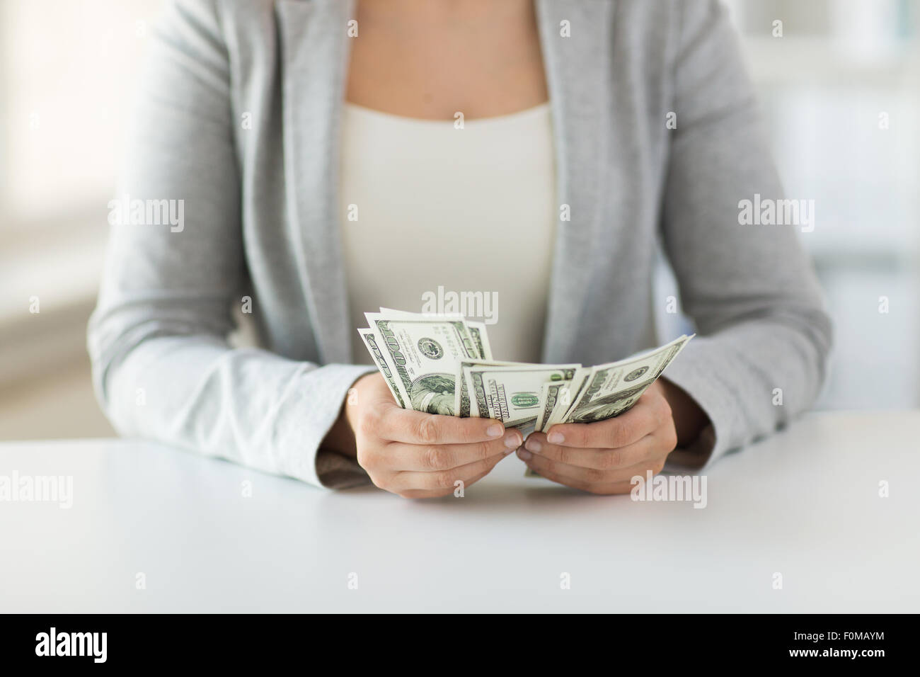 close up of woman hands counting us dollar money Stock Photo