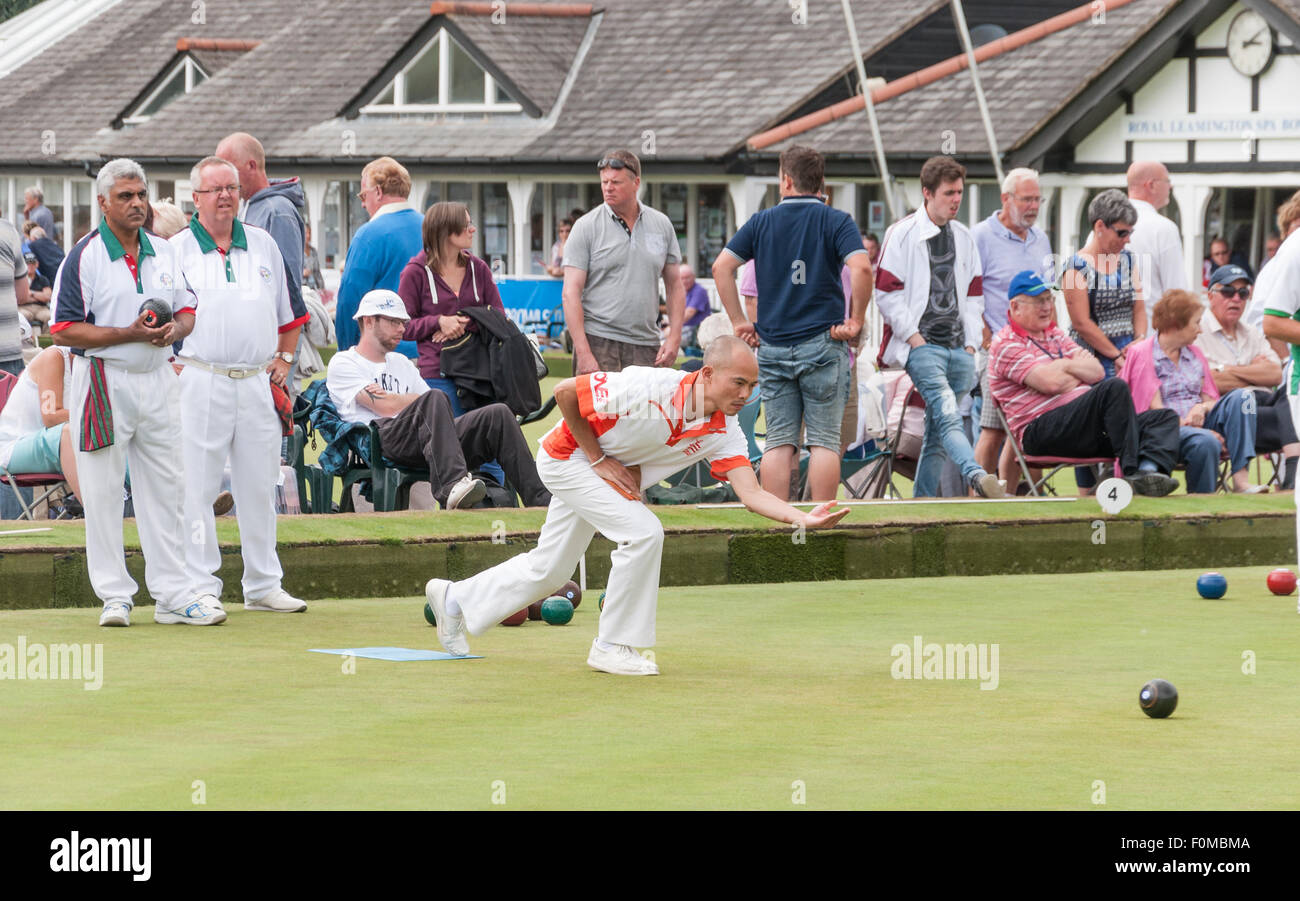 A bowler releases the wood in a men's match at the National Bowls Championship in Leamington Spa. Stock Photo