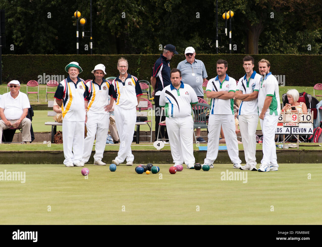 Two sides wait for the next bowl during a match in the National Bowls Championship. Stock Photo