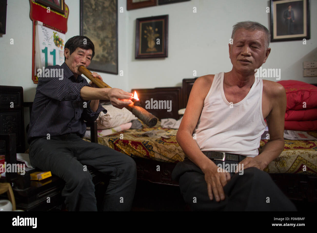 smoking opium in Vietnam Stock Photo