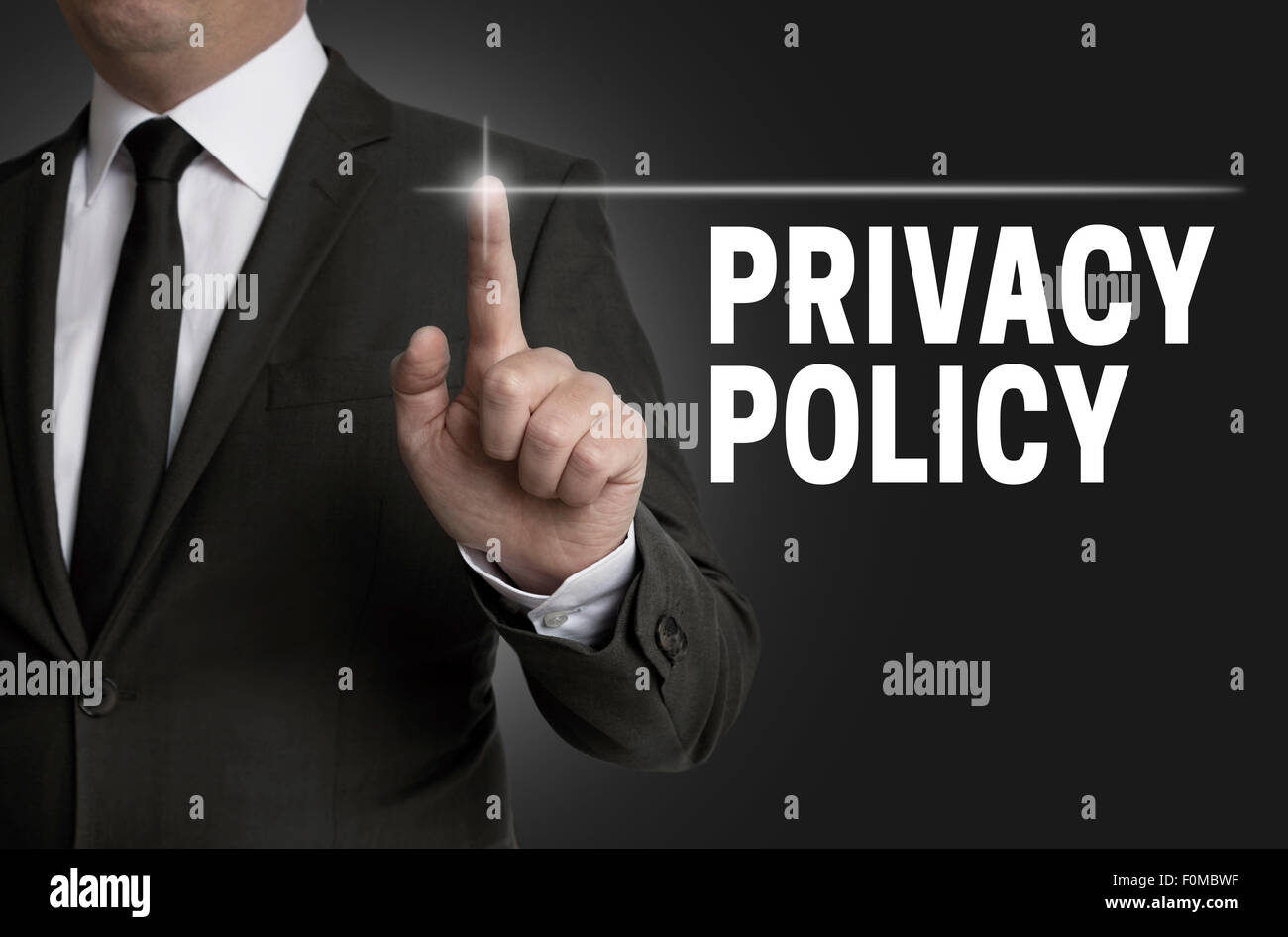 Privacy Policy touchscreen is operated by businessman. Stock Photo
