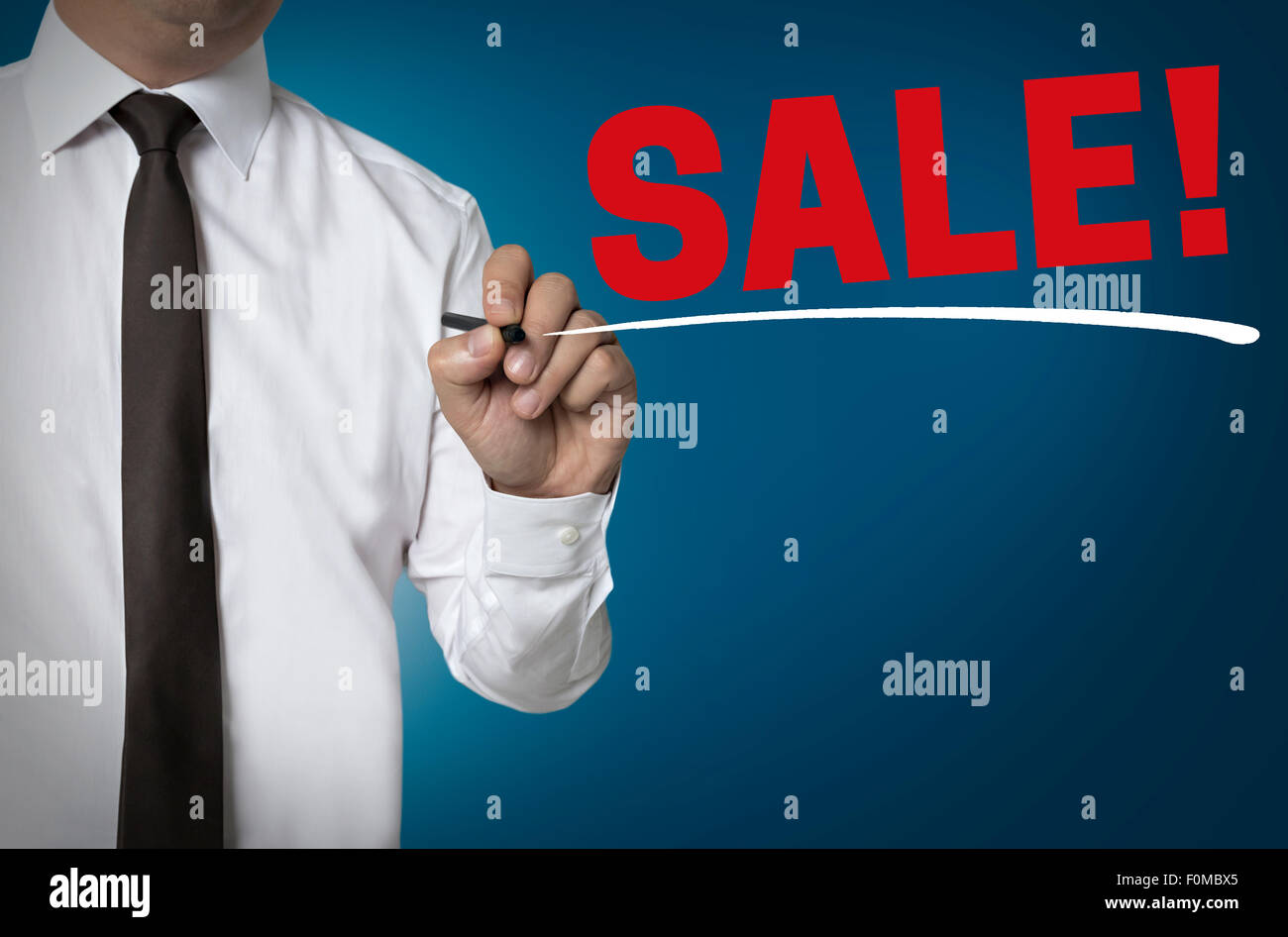 Sale is written by businessman background. Stock Photo