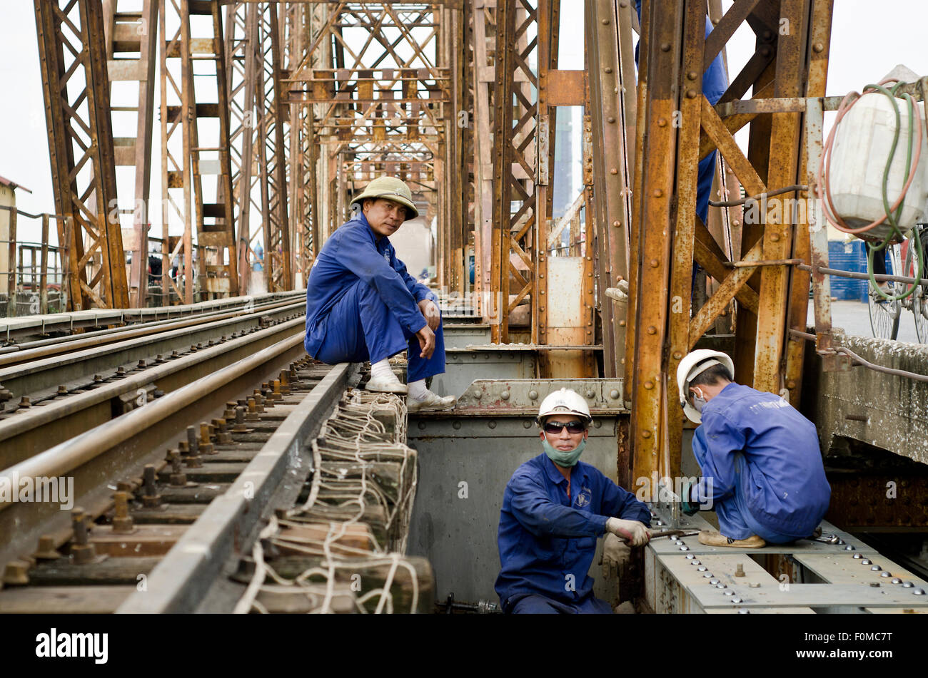 Workers on the Long Bien bridge, Hanoi,Vietnam Stock Photo