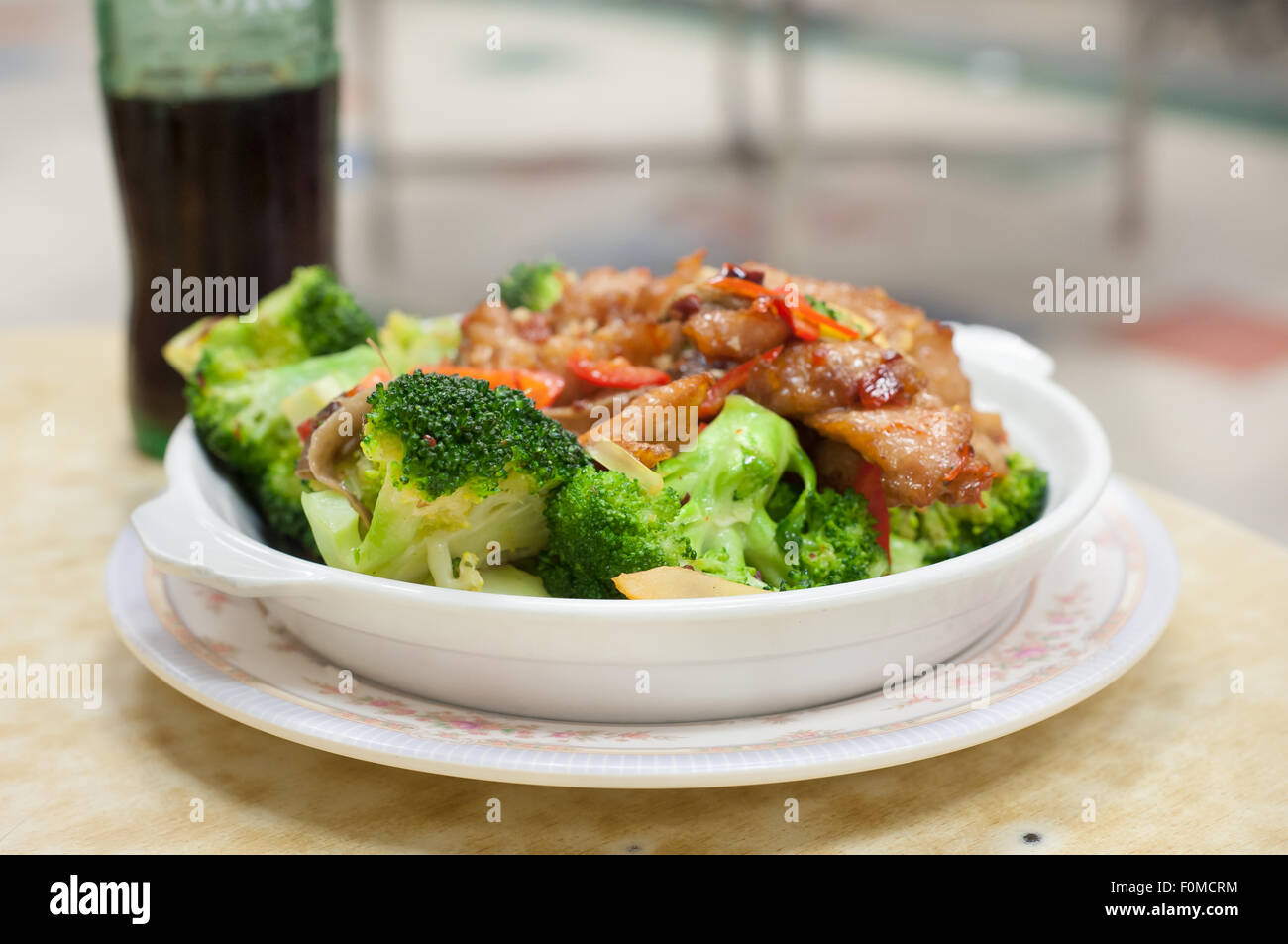 Stir-fried pork and broccoli dish served at a Hong Kong Cooked Food Centre Stock Photo