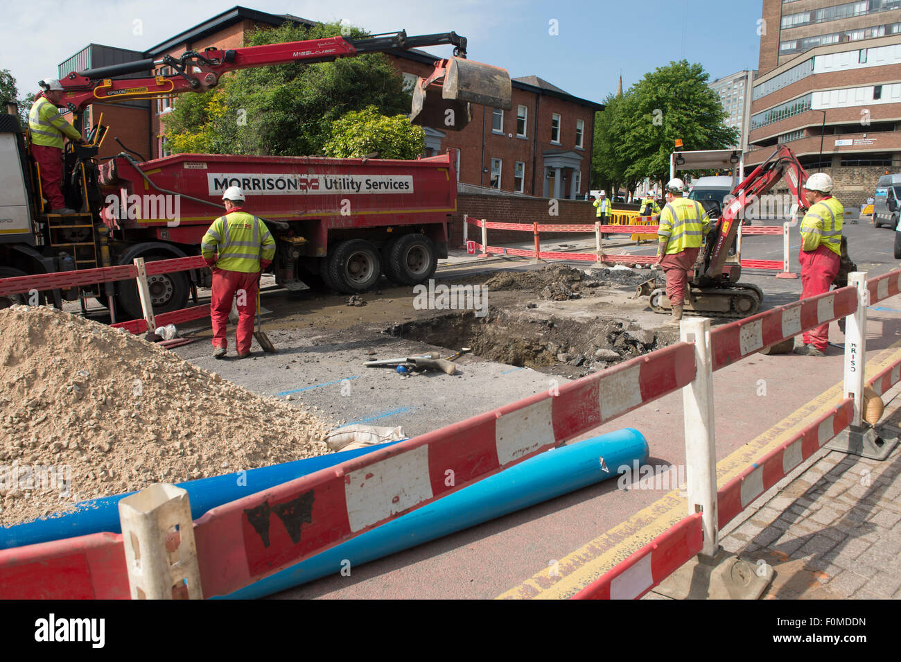 Yorkshire Water repair a major leak in one of their pipes on a Glossop Road in Sheffield Stock