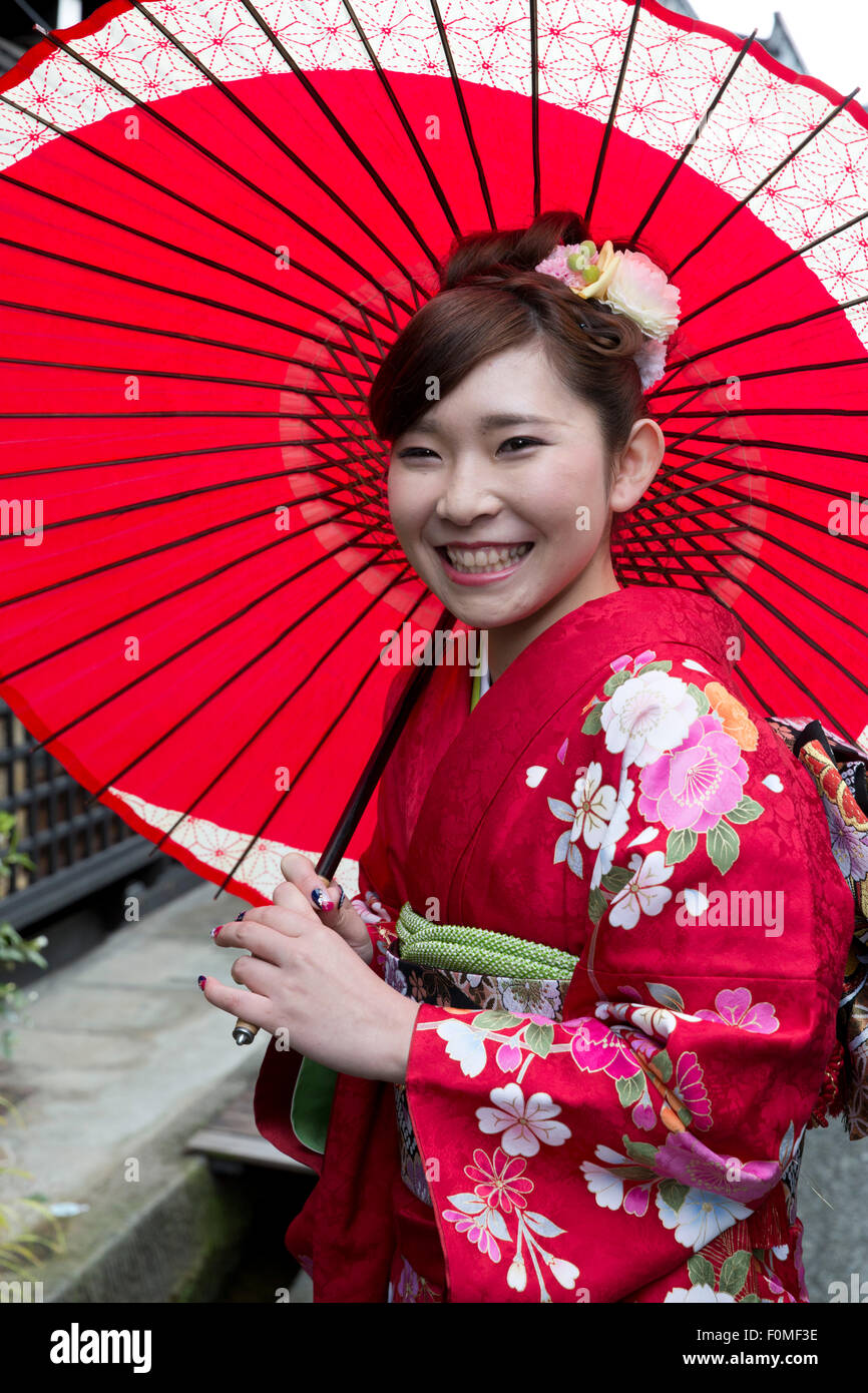 Young Japanese girl in traditional kimono and umbrella, Takayama