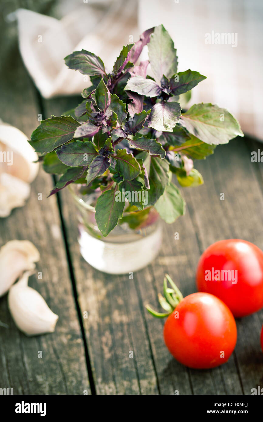 bunch of basil on old table Stock Photo - Alamy