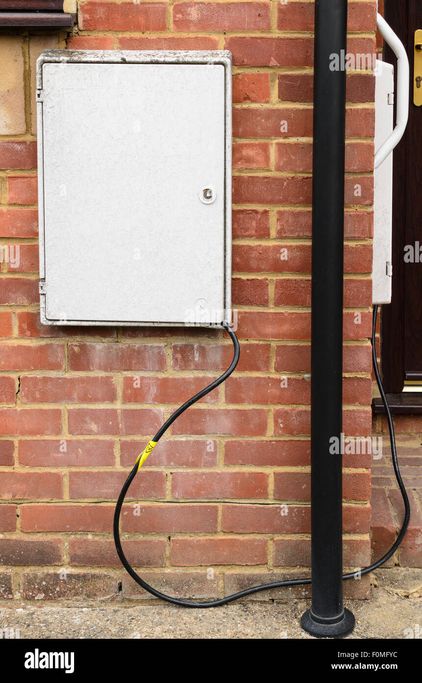 Mock up of what it might look like when Electricity Theft takes place. Two Electric Meter boxes are shown as if 'linked'. Stock Photo