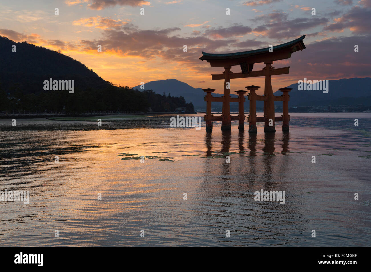 The floating Miyajima torii gate of Itsukushima Shrine at sunset, Miyajima Island, Western Honshu, Japan, Asia Stock Photo