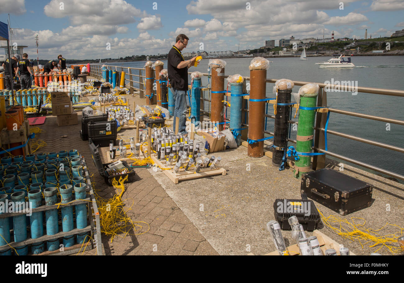 Plymouth, UK. 18th Aug, 2015. Spyrotechnics engineer sets up the large eight inch mortars and shells ready for their fire work display at the british Firework championships 2015, in Plymouth UK. The firing is all controlled by computer to ensure accuracy. Credit:  Anna Stevenson/Alamy Live News Stock Photo