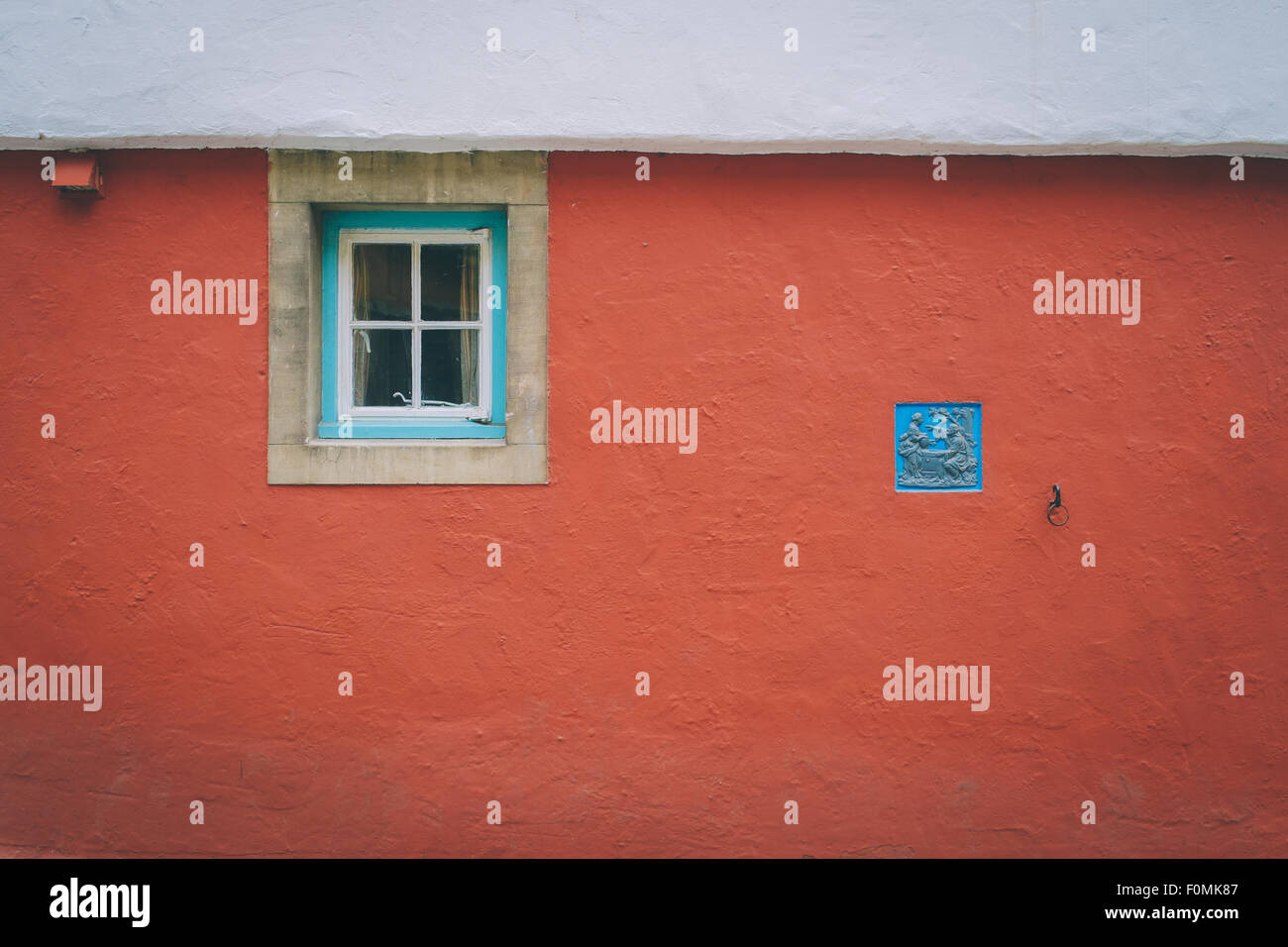 A small window in a red wall Stock Photo - Alamy