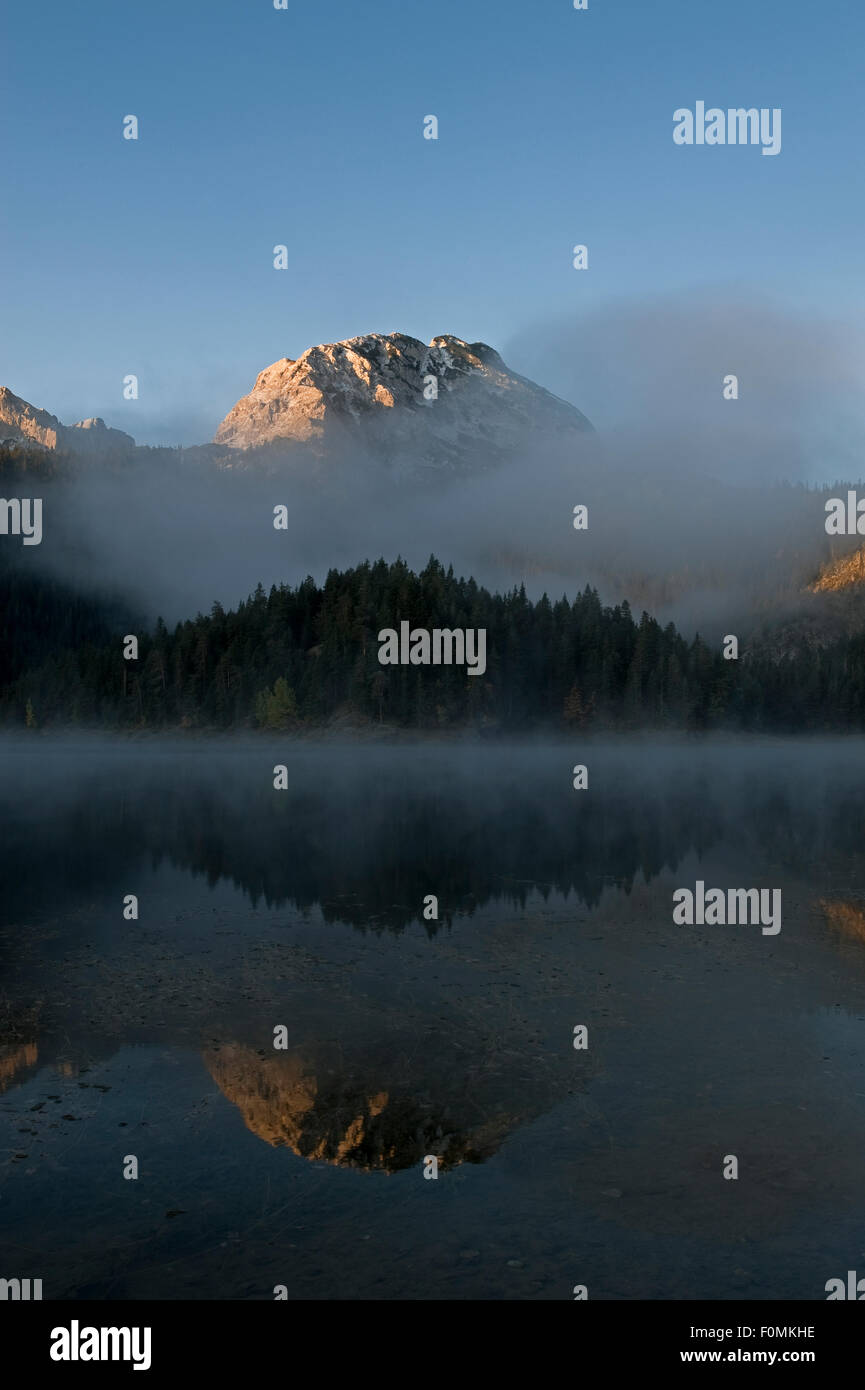 Big Bear Peak Reflected In Black Lake With Morning Mist Over Forest big-bear-peak-reflected-in-black-lake-with-morning-mist-over-forest