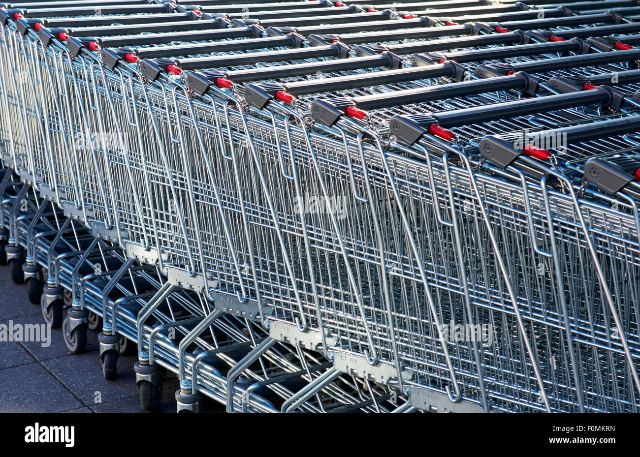 Trolleys outside Aldi store, UK Stock Photo Alamy
