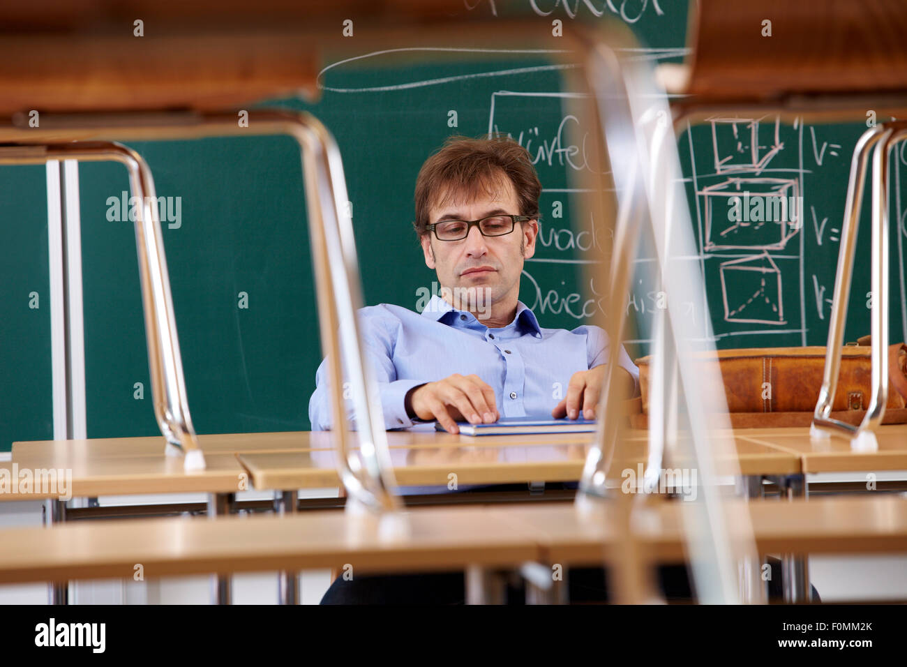 Exhausted teacher in the classroom Stock Photo Alamy