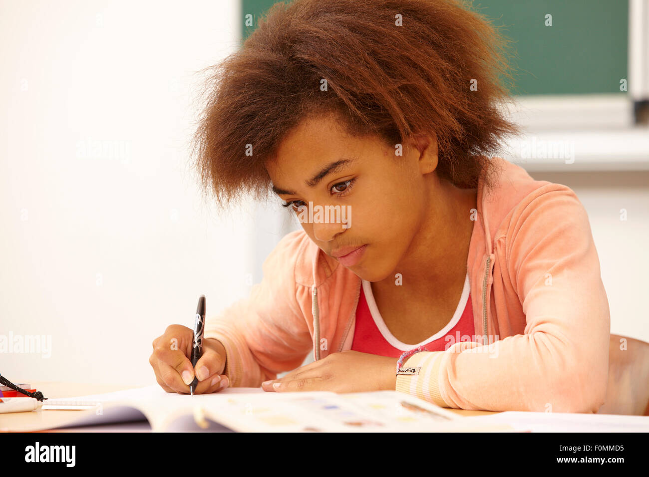 Concentrated girl in school Stock Photo
