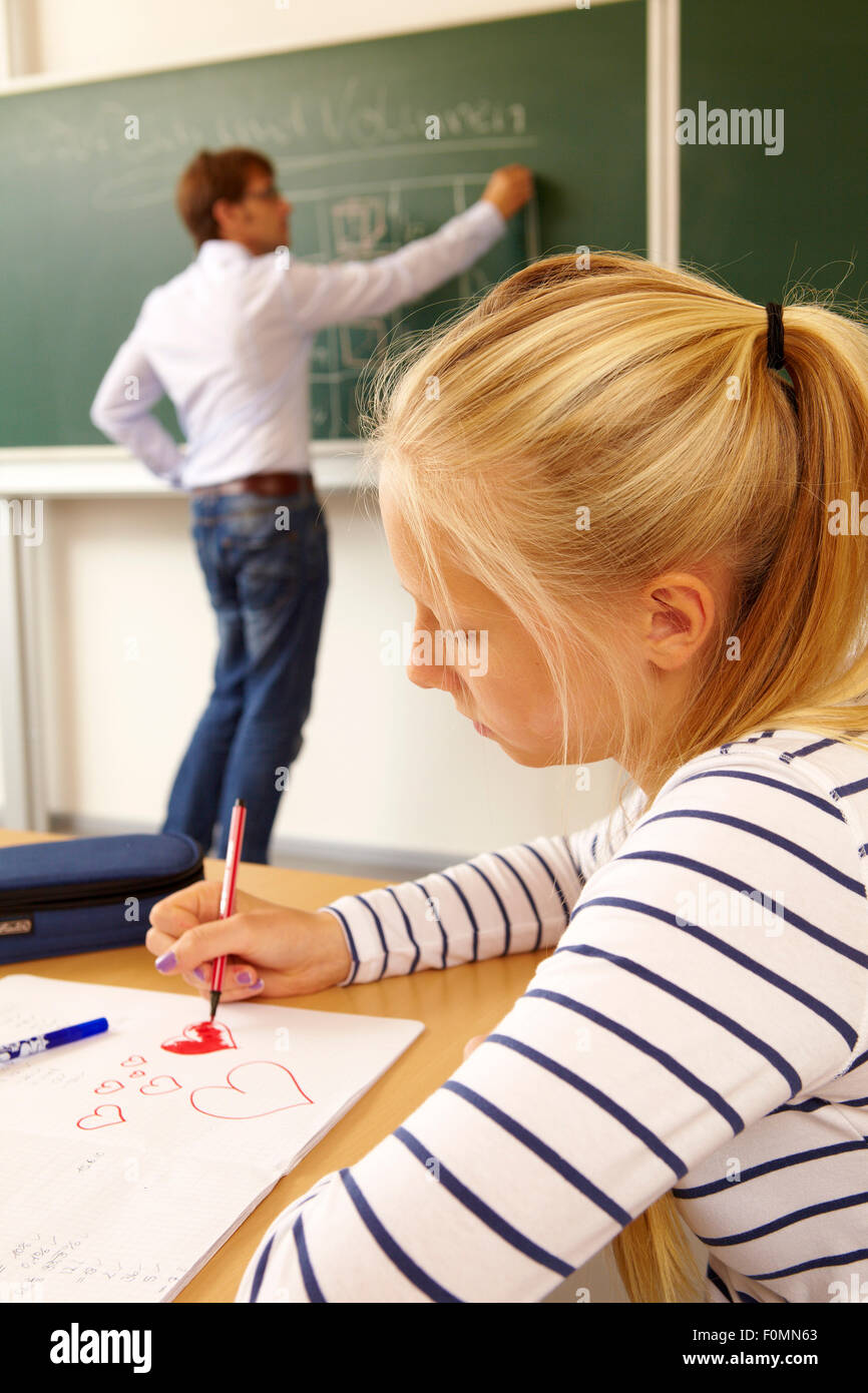 Girl in love is inattentive in the lessons Stock Photo
