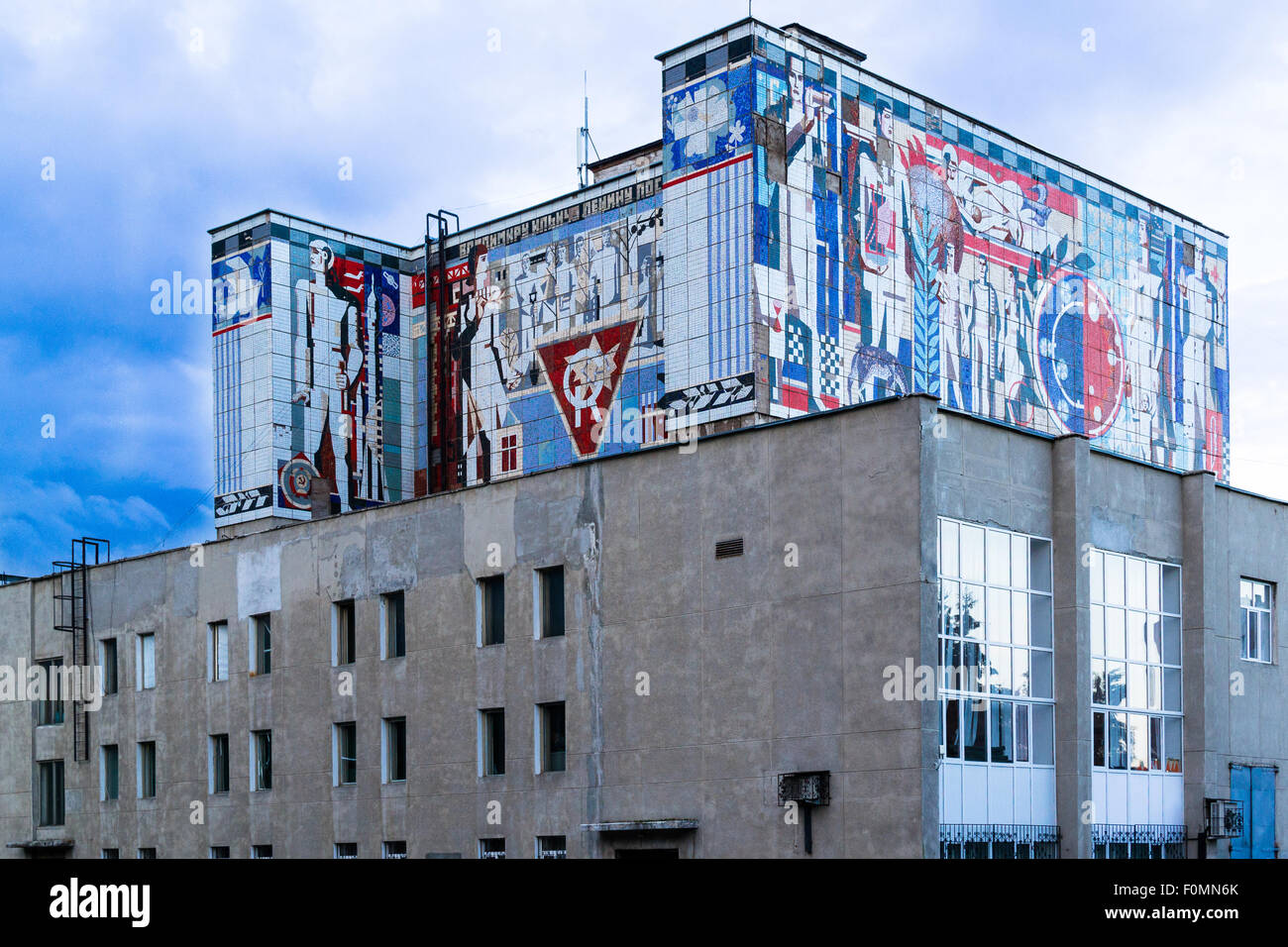 Old soviet era building mural in color created on the side of a block style building Stock Photo
