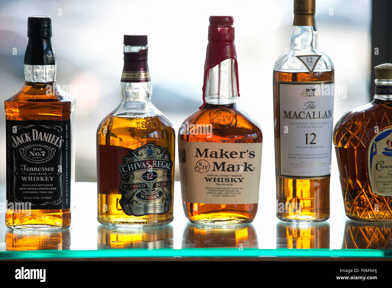 whiskey bottles shelf Stock Photo