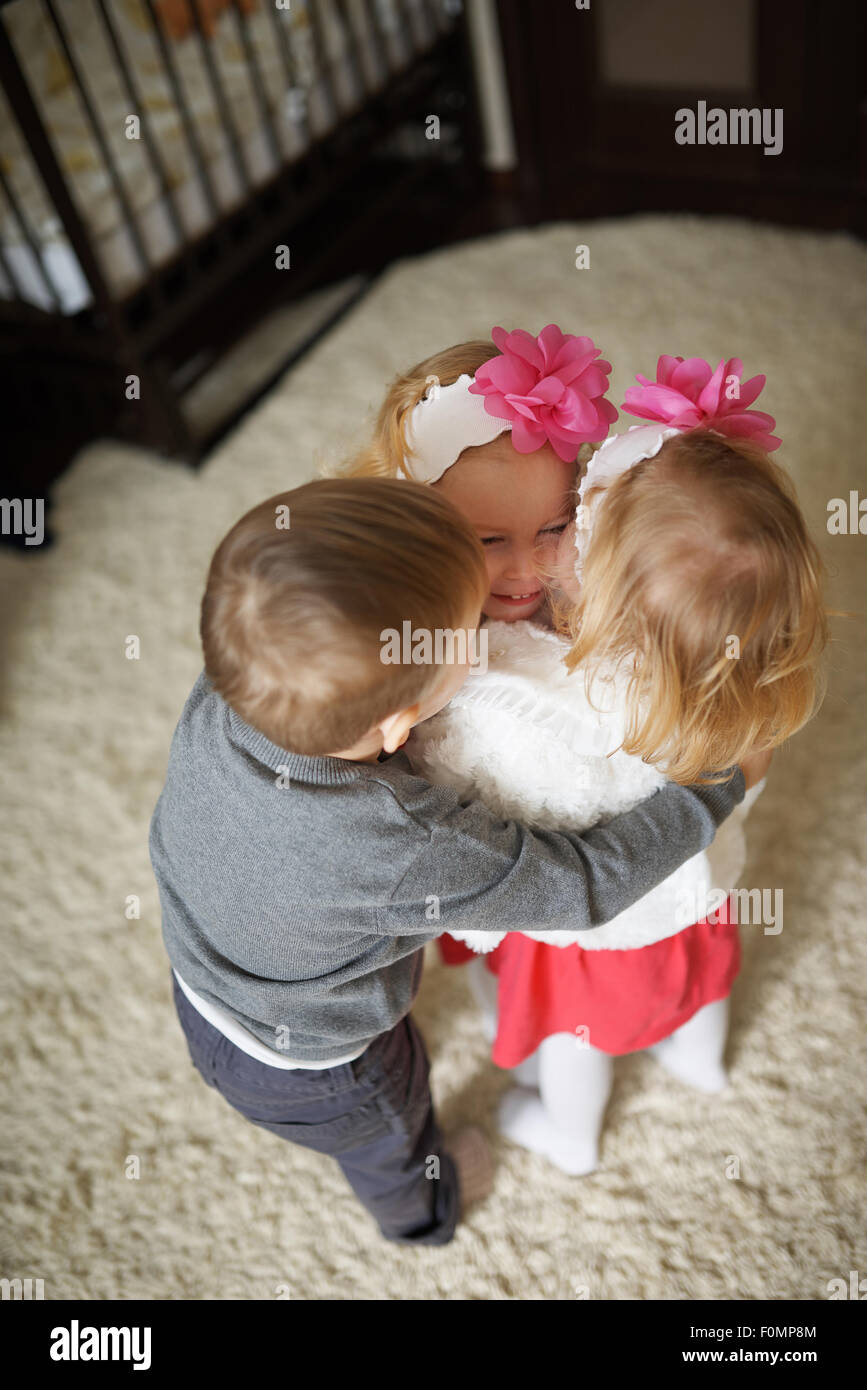 boy with two girls twins Stock Photo Alamy
