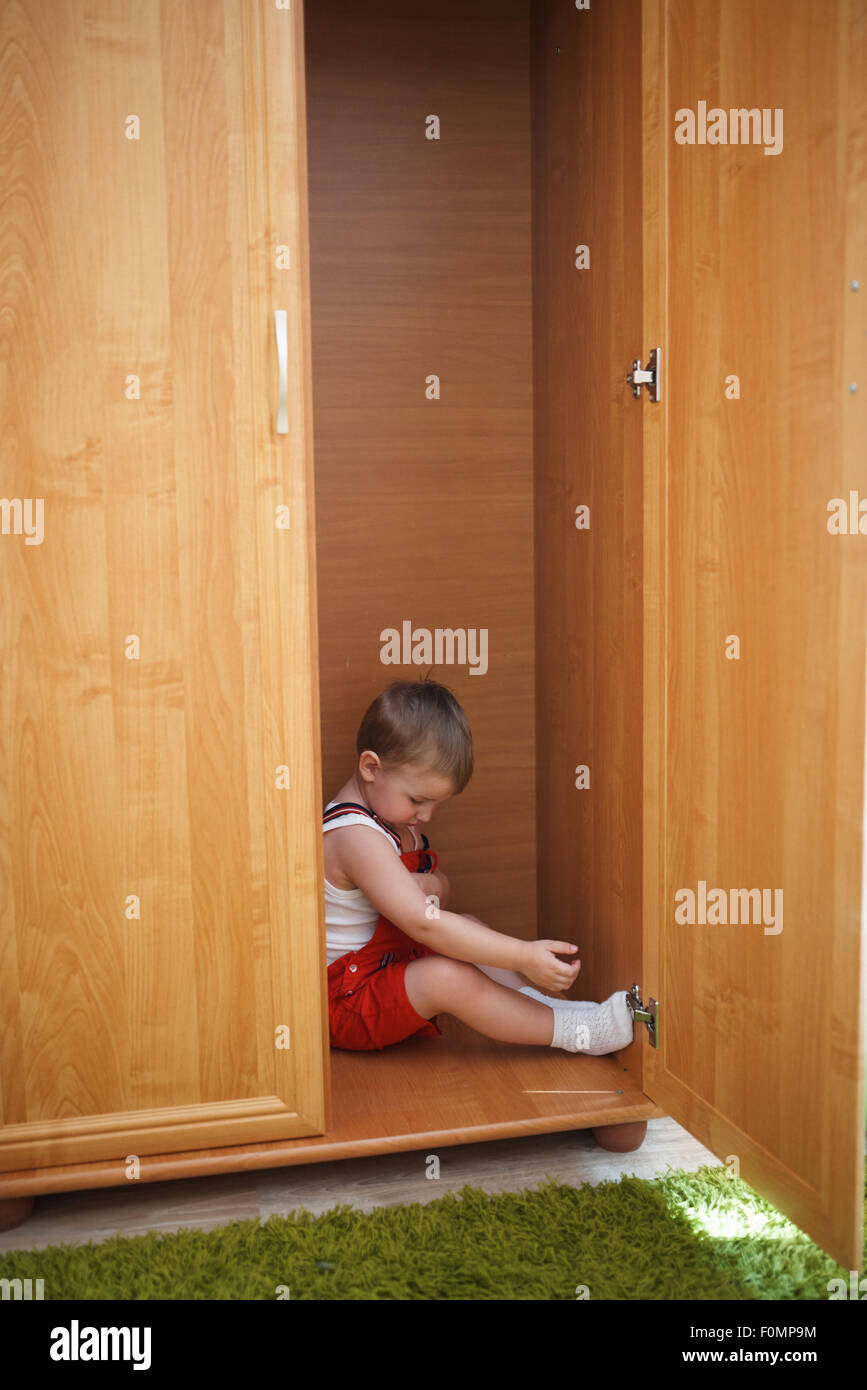 Little Boy Hiding In Closet Stock Photo 86508400 Alamy