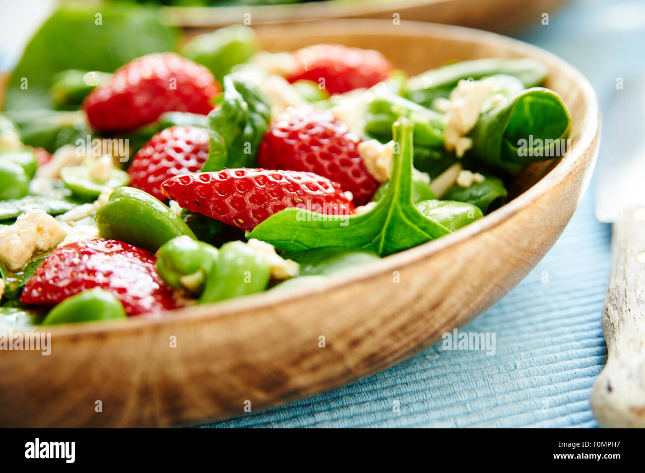 Fava bean, spinach and strawberry salad Stock Photo