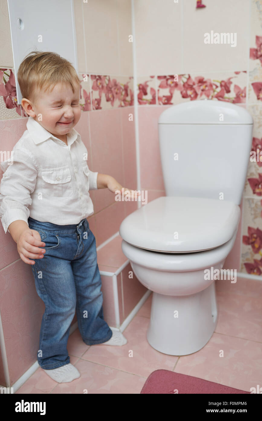 little boy looks in toilet Stock Photo Alamy
