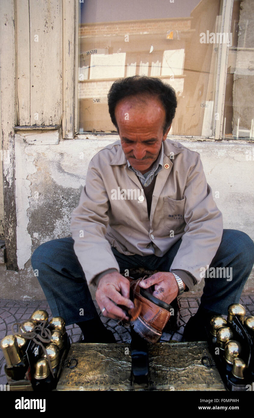 Shoe shine man in a street in Cevizli Akseki Turkey Stock Photo