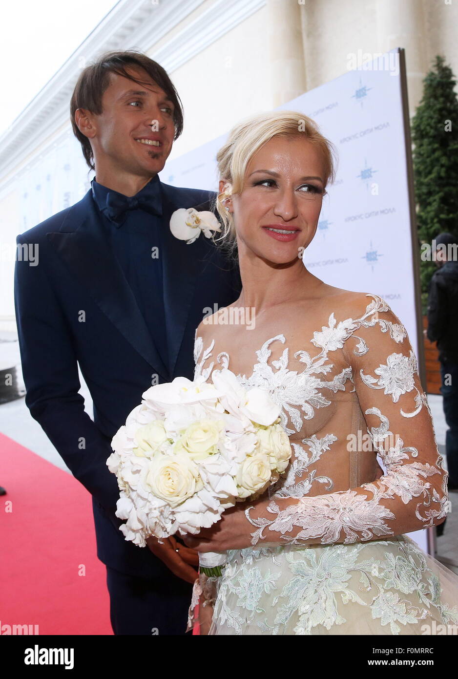Moscow, Russia. 18th Aug, 2015. Two-time Olympic figure skating champions Maxim Trankov (L) and Tatyana Volosozhar during their wedding at the Rose Bar restaurant. Credit:  Vyacheslav Prokofyev/TASS/Alamy Live News Stock Photo