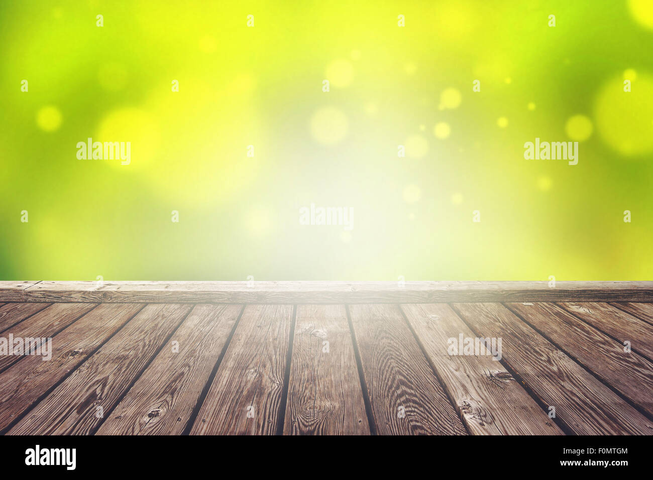 Empty Rustic Wooden Deck with Abstract Blur Natural Background for Product Placement Backdrop with Sunlight Stock Photo