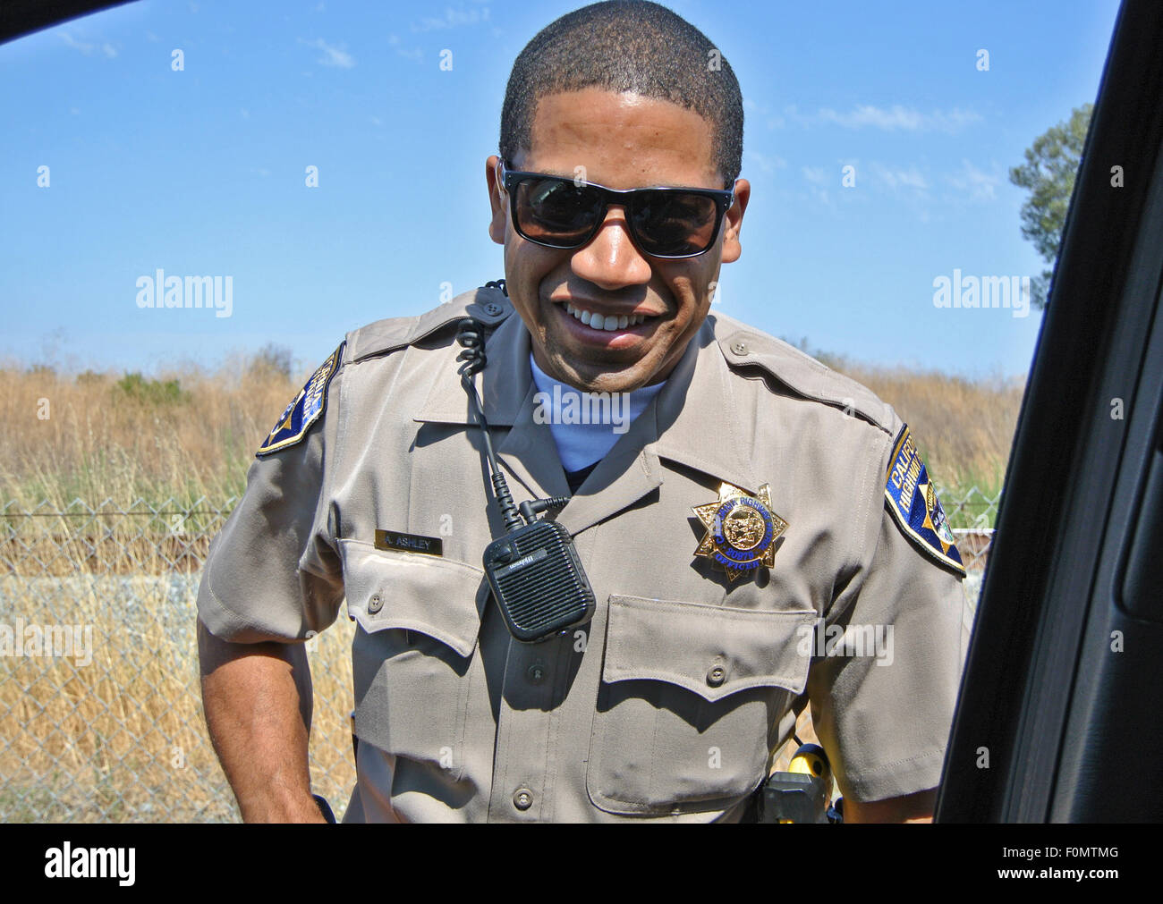 highway patrol officer makes traffic stop on California highway Stock Photo