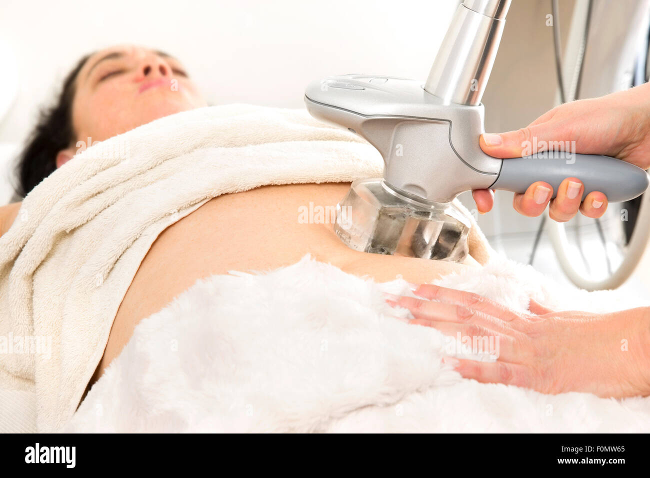 Slimming and cellulite laser treatment at clinic Stock Photo