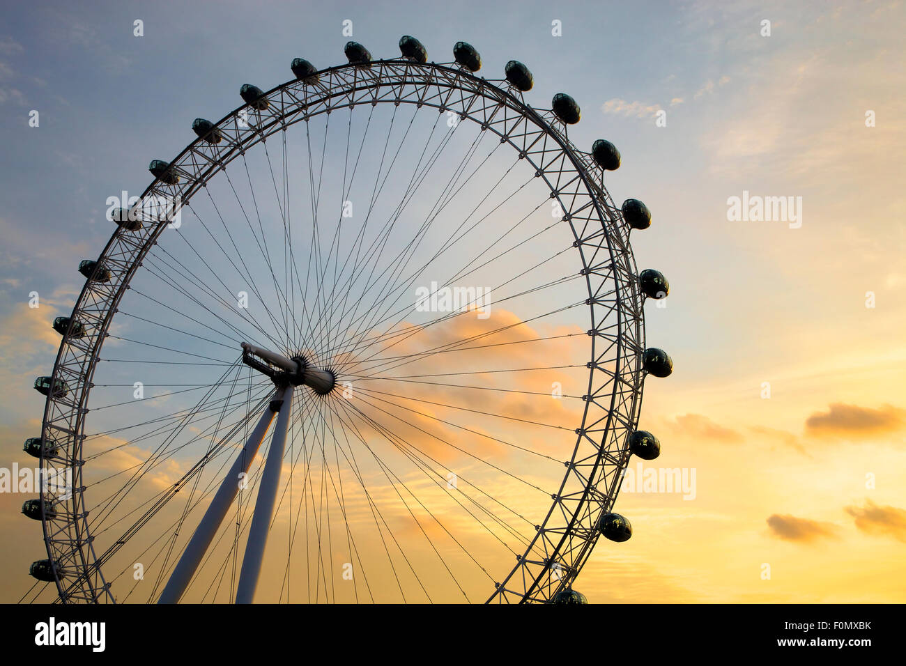 The famous landmark London Eye at Dusk in Westminster by the Thames River in London. Stock Photo