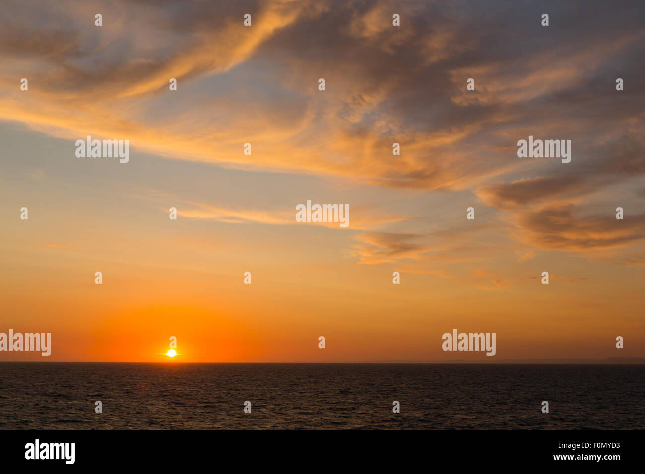 18th Aug, 2015. UK Weather: Sunset viewed from the deck of the Brittany Ferries M.V. Barfleur on its voyage to Poole in Dorset from Cherbourg in Normandy on Tuesday the 18th August 2015. Credit:  Chris Stevenson/Alamy Live News Stock Photo