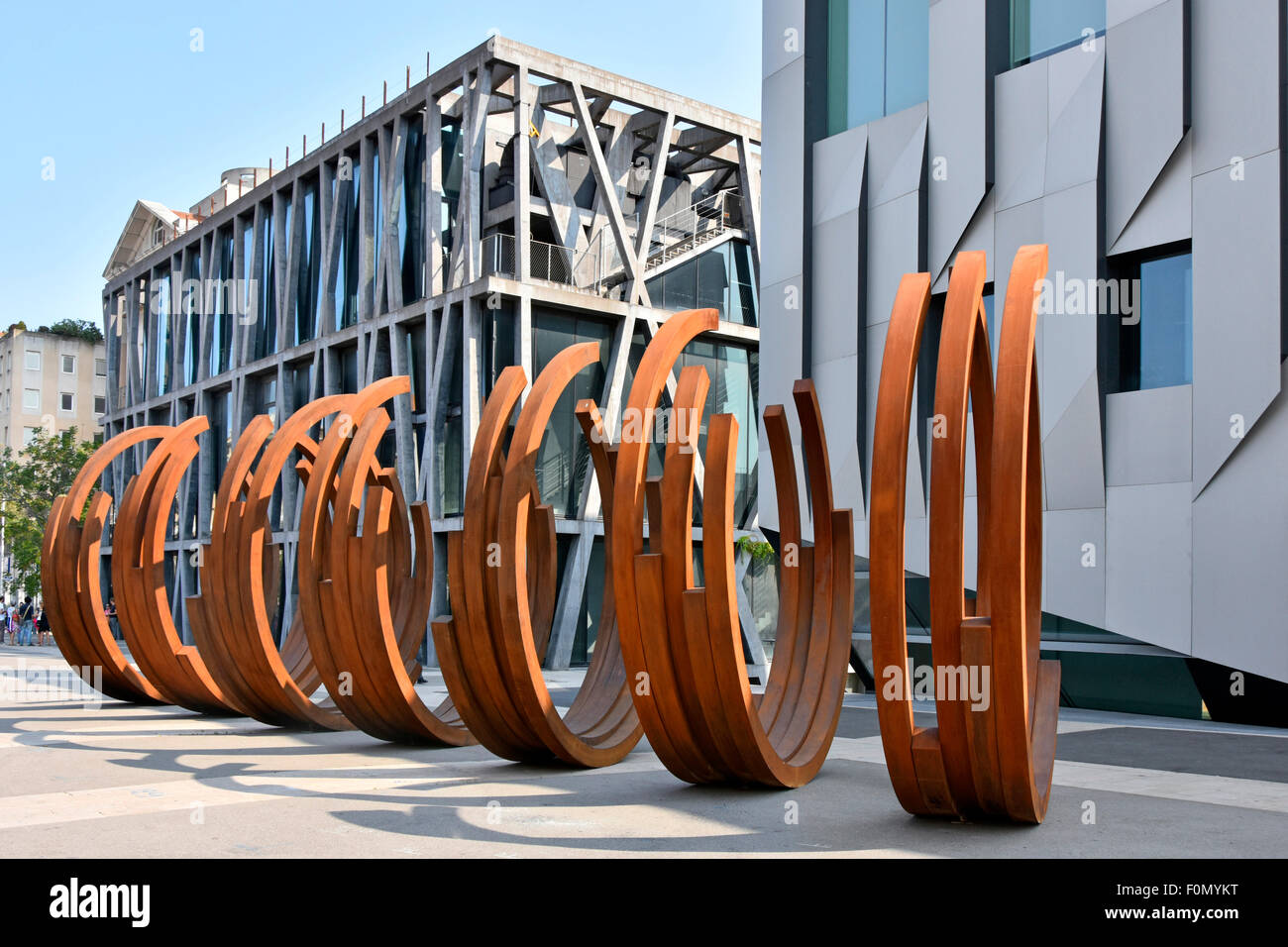 Modern street art by French conceptual artist Bernar Venet a series of steel Arc sculpture this at the cultural center Aix en Provence South of France Stock Photo