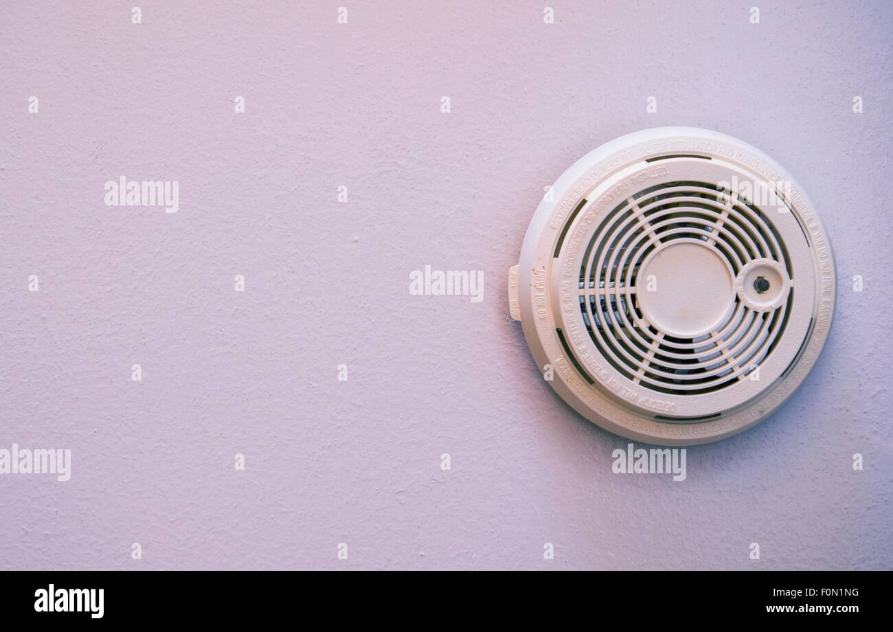 Residential Smoke Detector Wall Mounted Device. Fire Protection Stock Photo  - Alamy